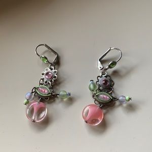 Earrings with pink and green stones.